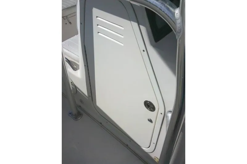 Slide: The Image of 2007 Cobia 214 Center Console boat interior door detail. - 19