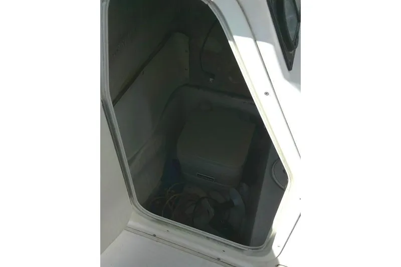 Slide: The Image of 2007 Cobia 214 Center Console boat interior with storage compartment. - 20