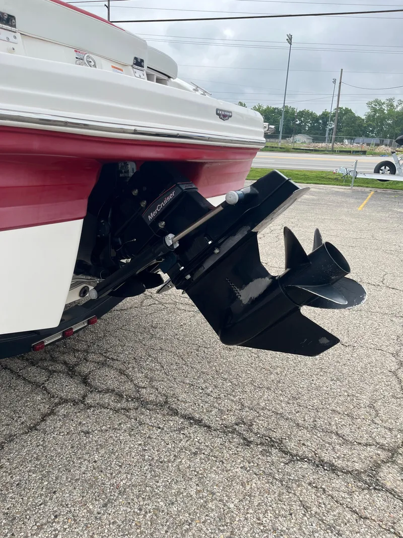 Slide: The Image of 2014 Chaparral 19 Sport H2O boat with MerCruiser outdrive on pavement. - 12