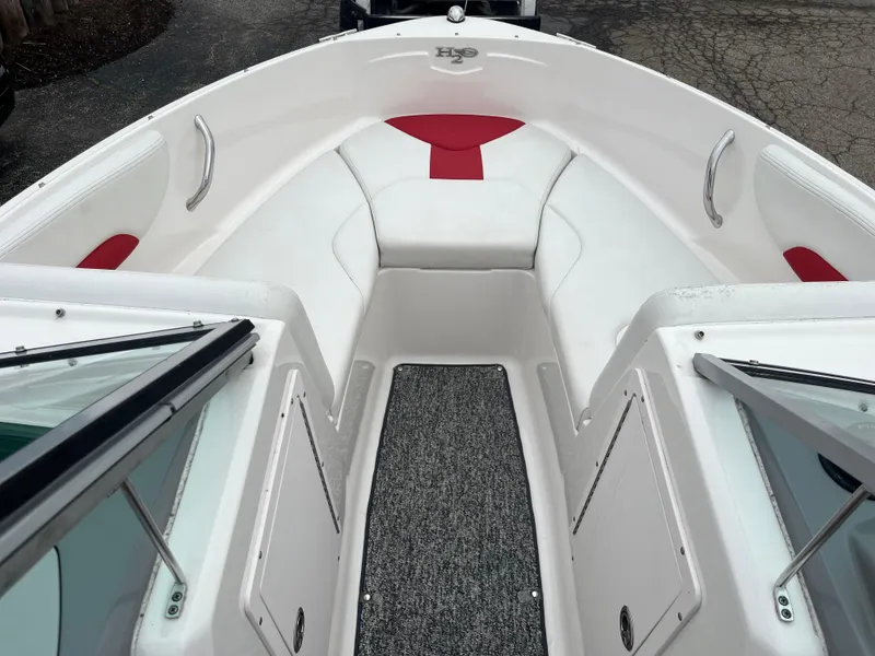 Slide: The Image of 2014 Chaparral 19 Sport H2O boat interior with white and red seating, open bow design. - 3