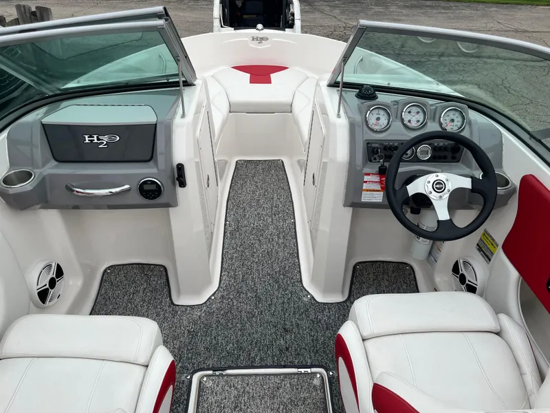 Slide: The Image of 2014 Chaparral 19 Sport H2O boat interior with steering wheel and dashboard. - 6