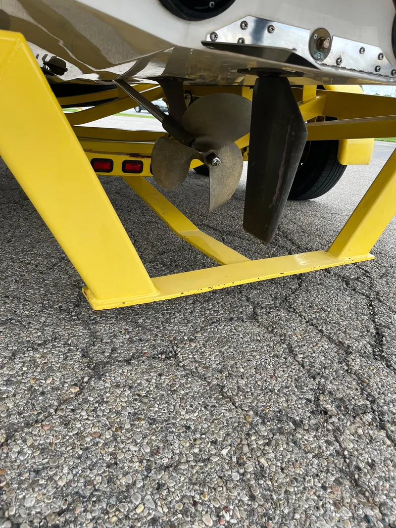 Slide: The Image of Yellow trailer with propeller of 2004 Tigé 20V Limited Edition boat. - 13