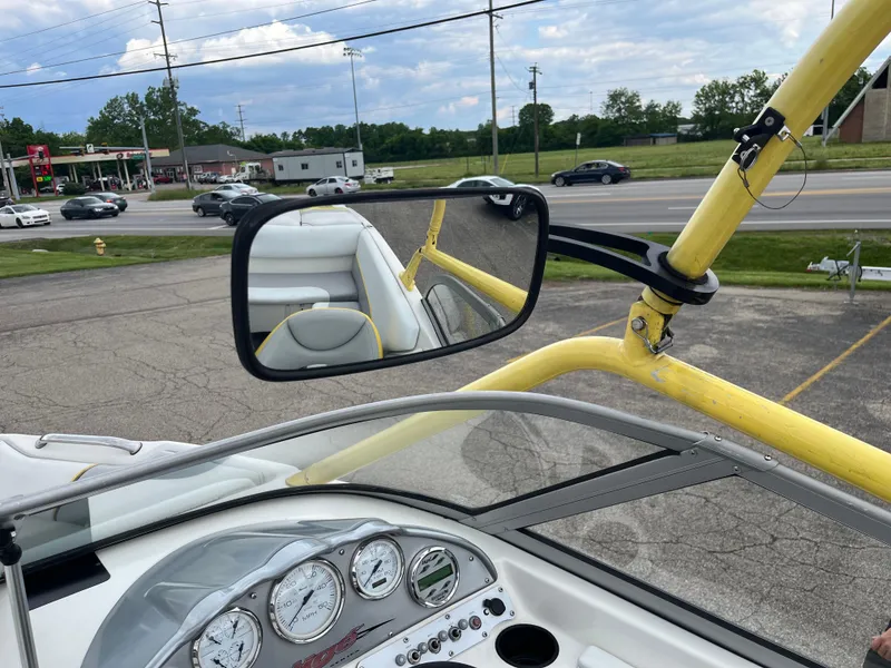 Slide: The Image of 2004 Tigé 20V Limited Edition boat dashboard with gauges and rearview mirror. - 17