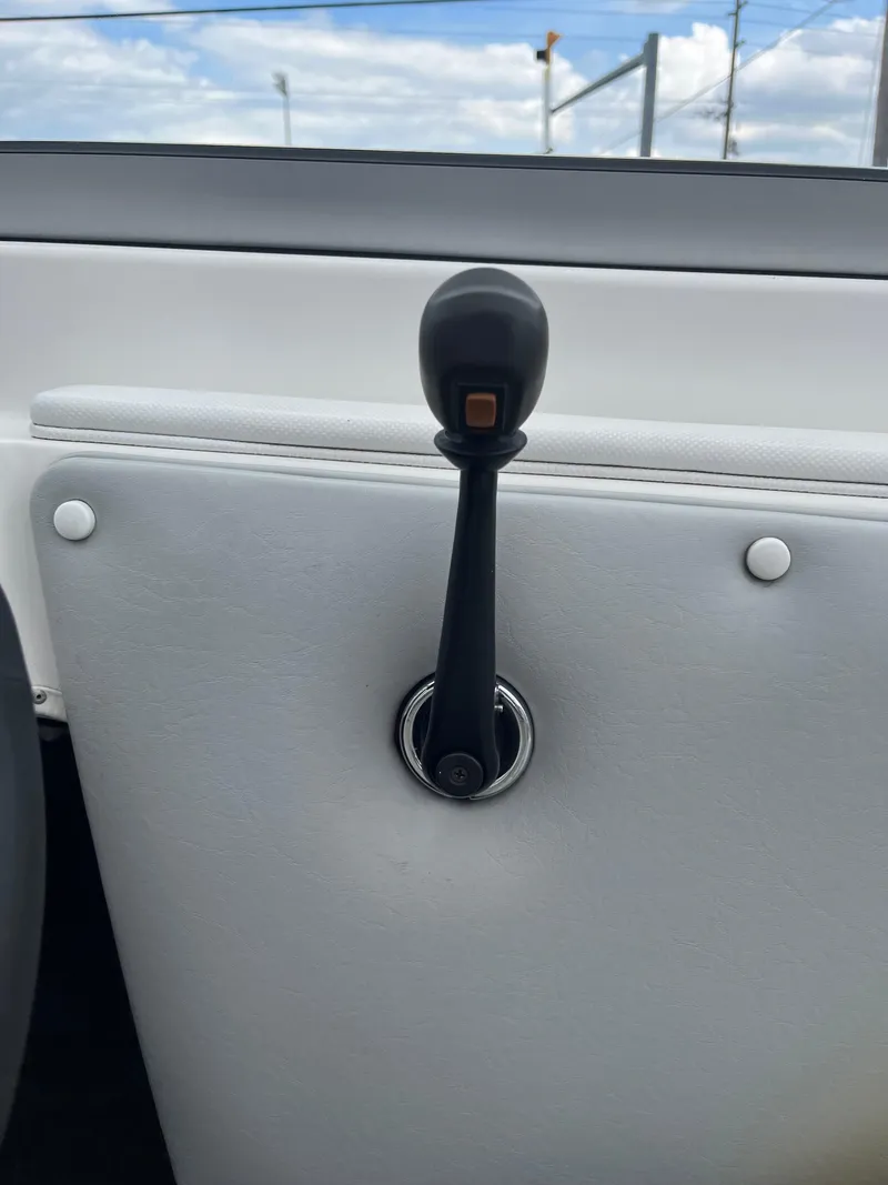 Slide: The Image of 2004 Tigé 20V Limited Edition boat throttle lever against white interior. - 20