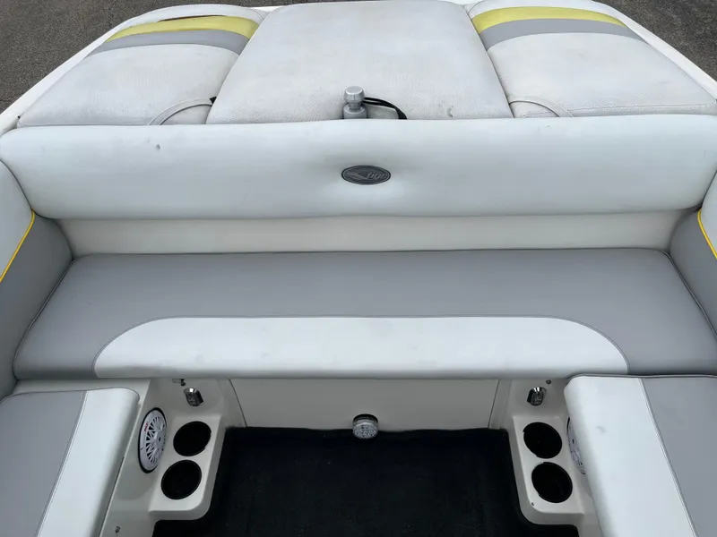 Slide: The Image of 2004 Tigé 20V Limited Edition boat interior with gray and yellow seating. - 3