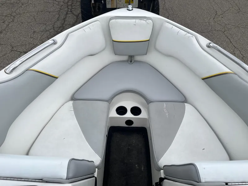 Slide: The Image of 2004 Tigé 20V Limited Edition boat interior with white and gray seating. - 6