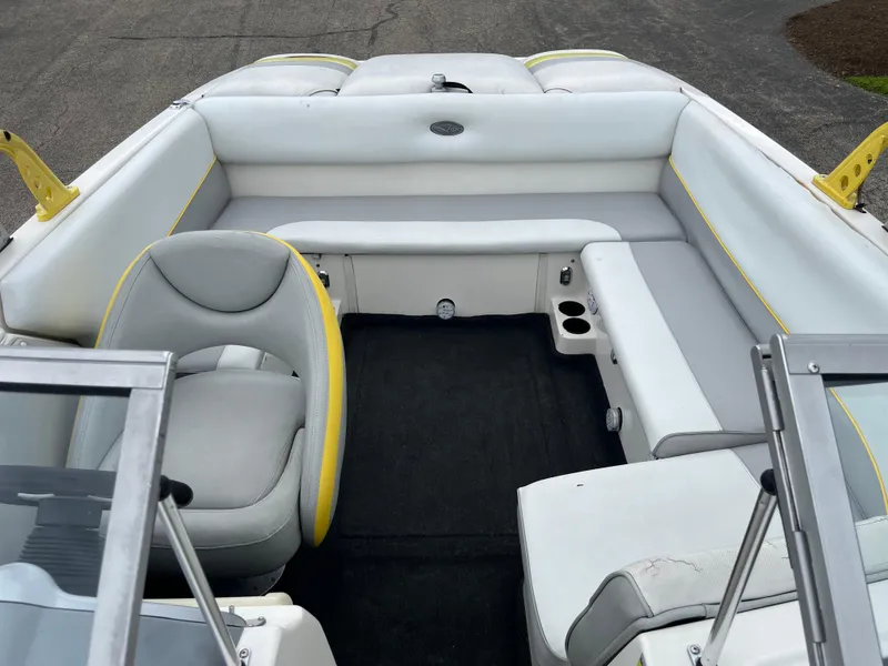 Slide: The Image of 2004 Tigé 20V Limited Edition boat interior with gray and yellow seating. - 8