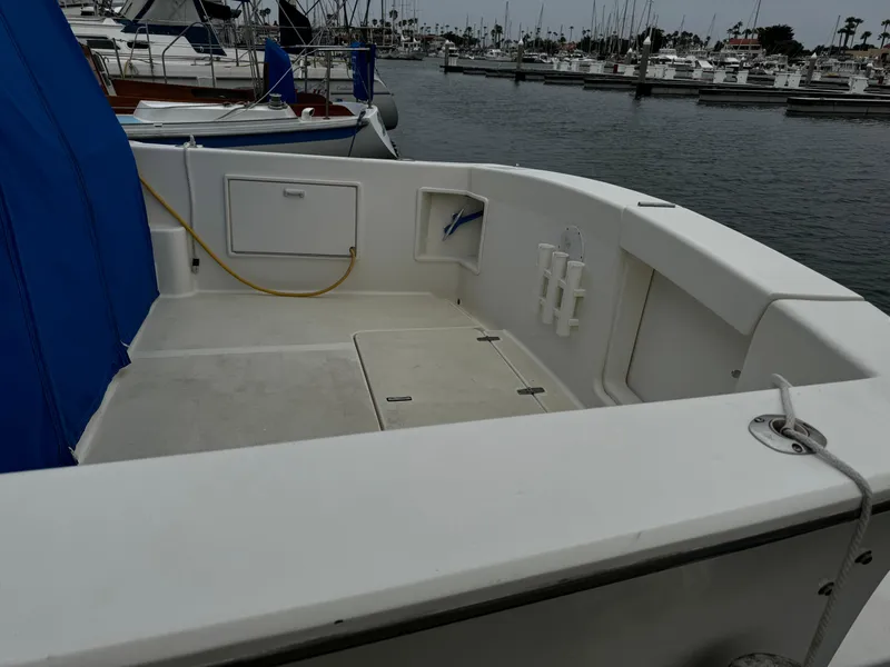 Slide: The Image of 1992 Ocean Yachts Sport Cruiser docked, featuring spacious deck and storage compartments. - 10