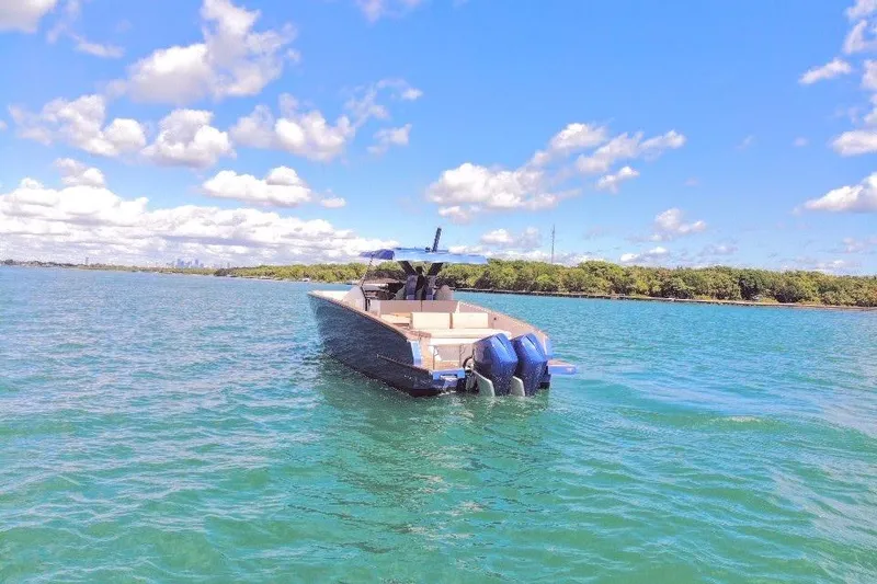 Slide: The Image of 2022 Tesoro T38 Outboard boat on clear blue water under a sunny sky. - 15
