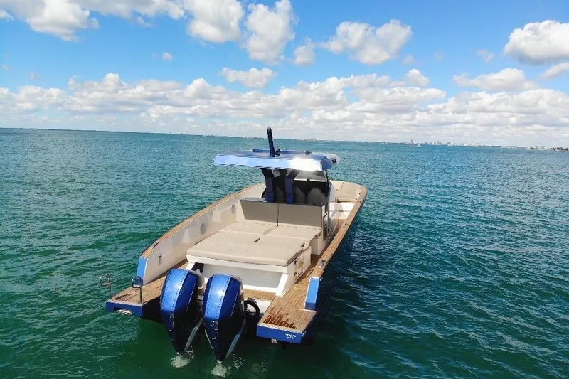 Slide: The Image of 2022 Tesoro T38 Outboard boat on open water under a blue sky. - 20