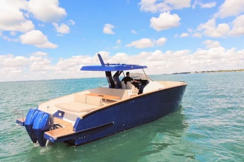 Slide: The Image of 2022 Tesoro T38 Outboard boat cruising on a sunny day with clear skies. - 21