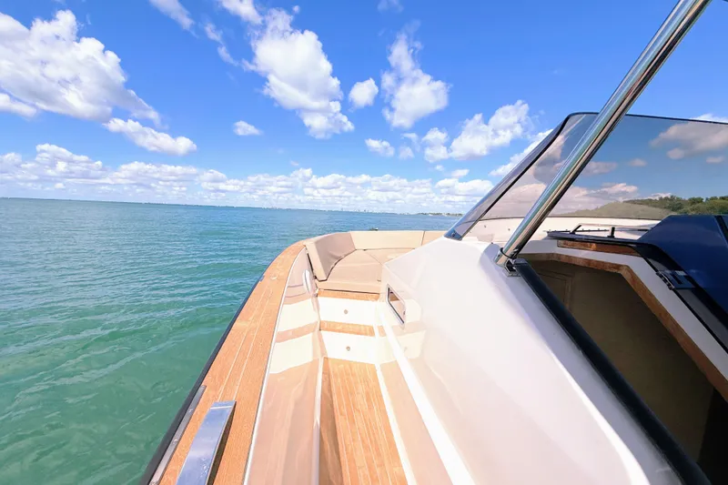 Slide: The Image of 2022 Tesoro T38 Outboard boat cruising on a sunny day with clear skies. - 27