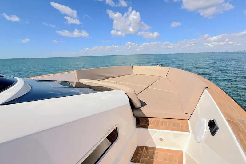 Slide: The Image of 2022 Tesoro T38 Outboard boat with spacious deck, cruising on calm blue waters. - 29