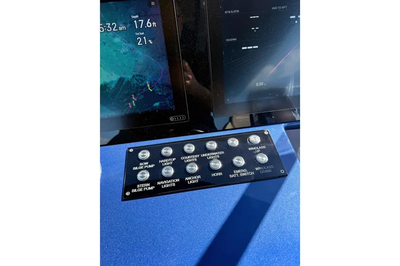 Slide: The Image of Control panel of 2022 Tesoro T38 Outboard with navigation and light switches. - 37