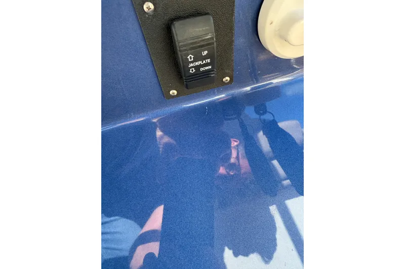 Slide: The Image of Close-up of 2022 Tesoro T38 Outboard jackplate switch on blue surface. - 38