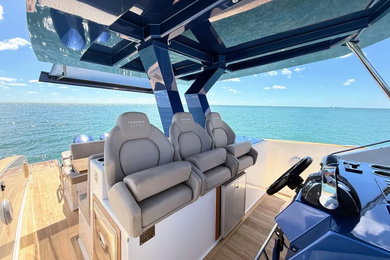Slide: The Image of Luxurious 2022 Tesoro T38 Outboard boat interior with plush seating and ocean view. - 39