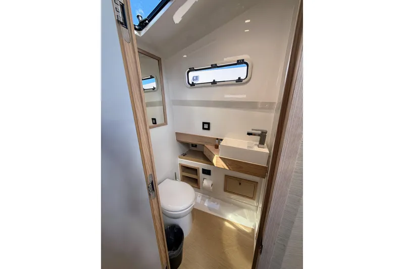 Slide: The Image of 2022 Tesoro T38 Outboard bathroom with modern fixtures and natural light. - 51