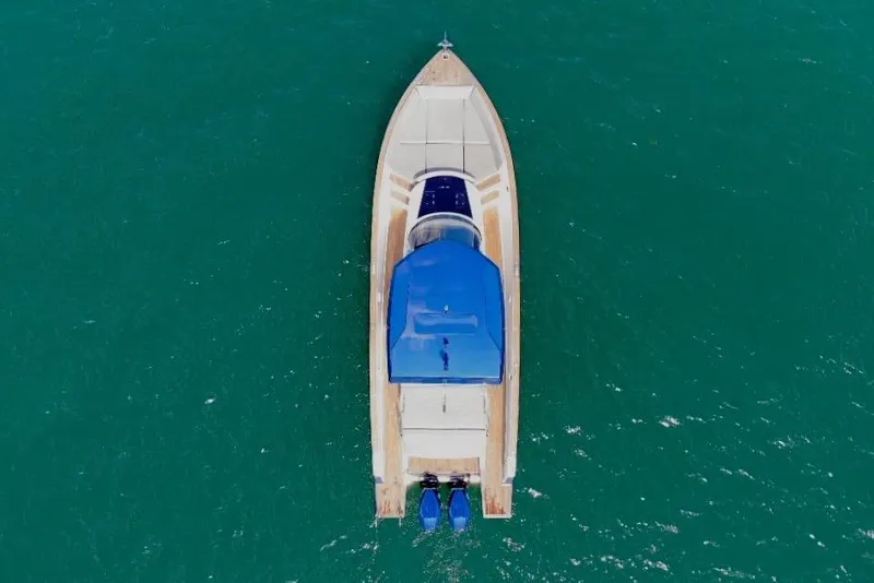Slide: The Image of Aerial view of 2022 Tesoro T38 Outboard boat on turquoise water. - 6