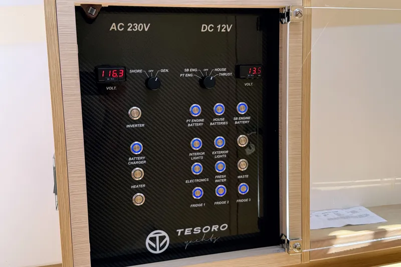 Slide: The Image of Control panel of 2022 Tesoro T38 Outboard, featuring AC 230V and DC 12V systems. - 60