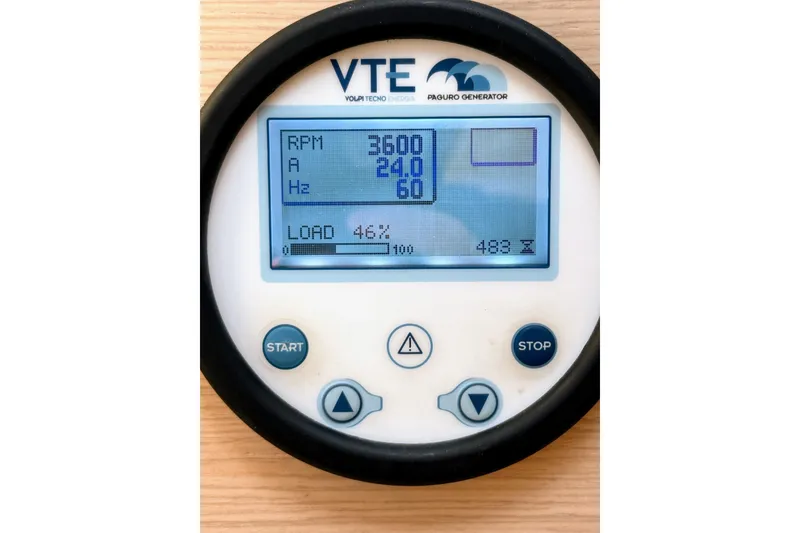 Slide: The Image of Digital display of a VTE Paguro generator showing RPM, amperage, and load percentage. - 62