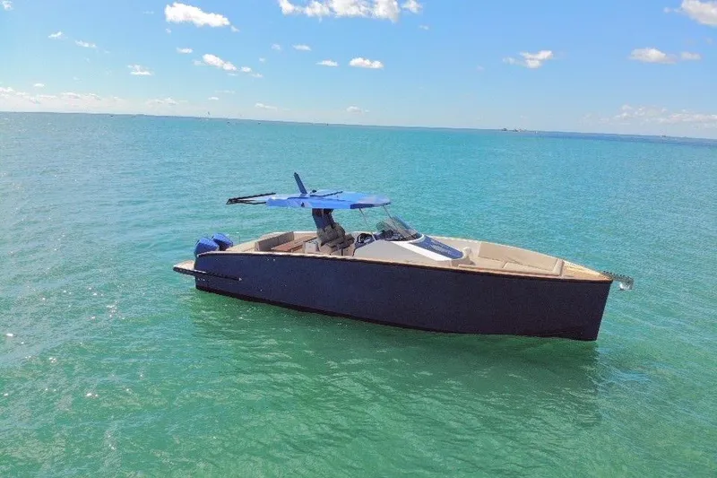 Slide: The Image of 2022 Tesoro T38 Outboard boat on calm blue sea under clear sky. - 9
