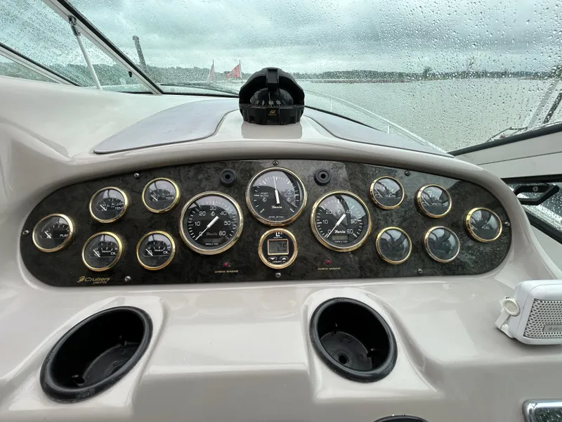 Slide: The Image of Dashboard of 2001 Cruisers Yachts 3470 Express with gauges and controls. - 22