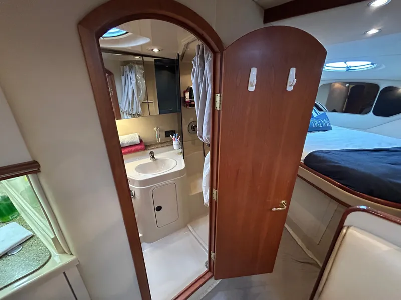 Slide: The Image of 2001 Cruisers Yachts 3470 Express interior with bathroom and bedroom view. - 46