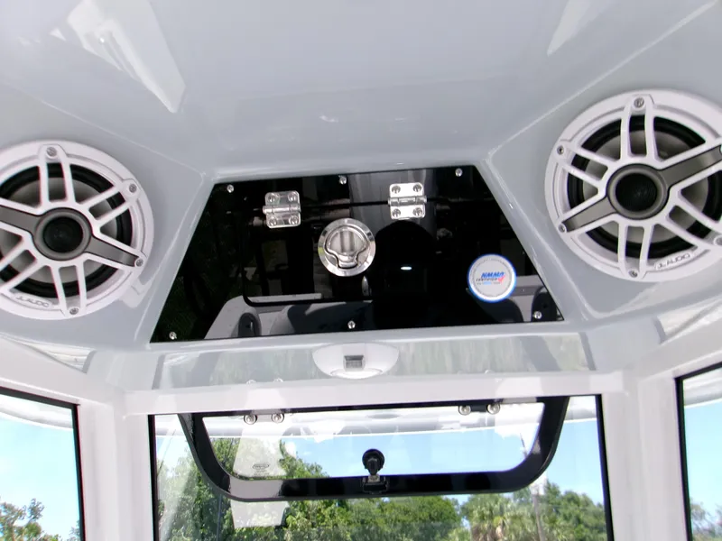 Slide: The Image of 2025 Sportsman Masters 247OE Bay Boat console with speakers and controls. - 10