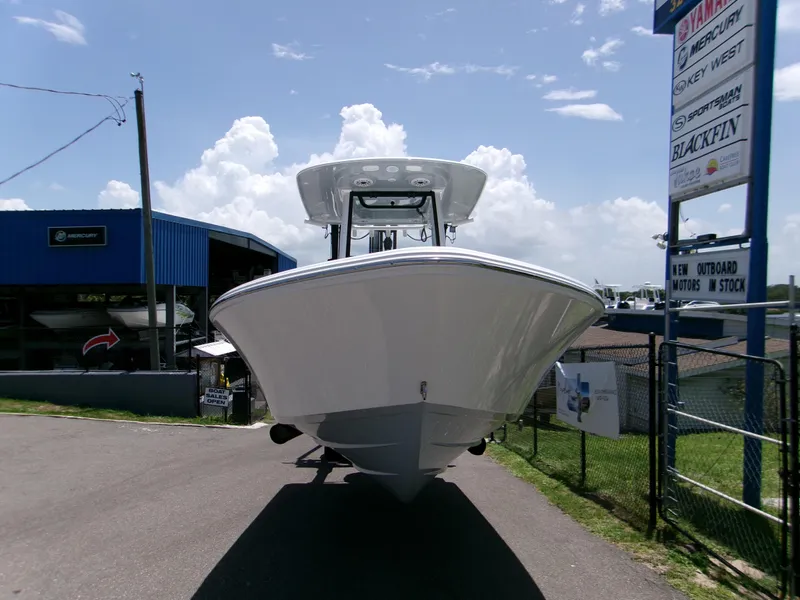 Slide: The Image of 2025 Sportsman Masters 247OE Bay Boat displayed outdoors under a clear sky. - 2