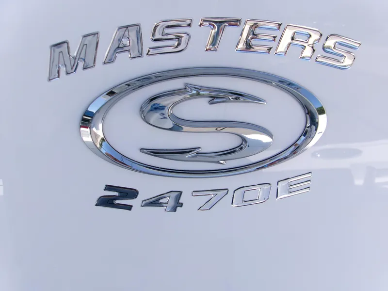 Slide: The Image of 2025 Sportsman Masters 247OE Bay Boat logo in chrome on white background. - 21
