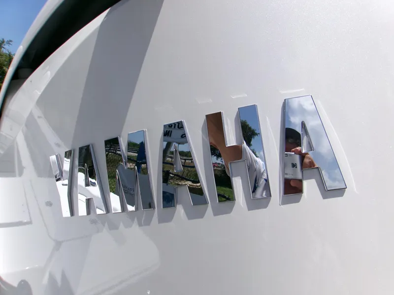 Slide: The Image of Chrome "Yamaha" logo on a 2025 Sportsman Masters 247OE Bay Boat. - 4