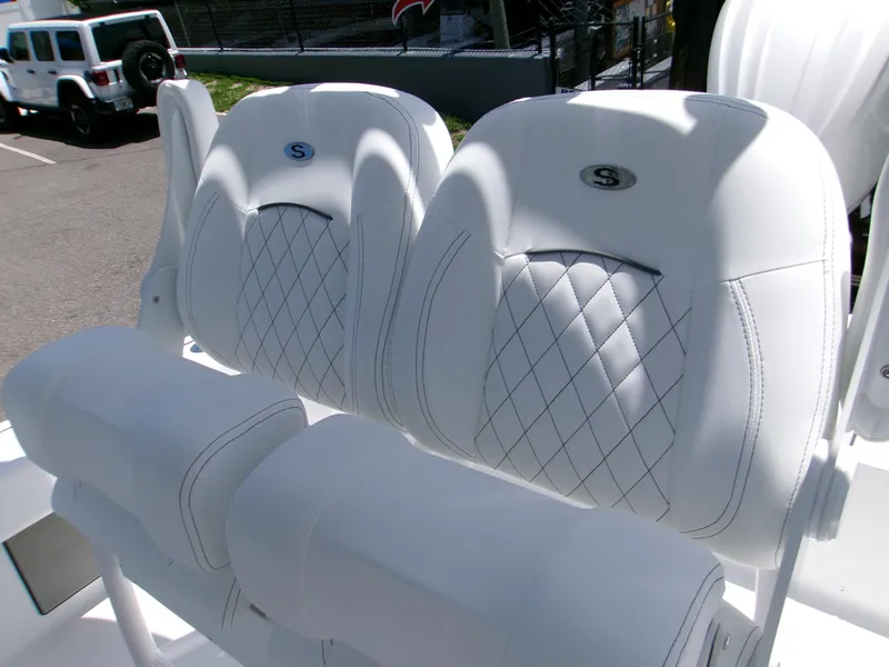 Slide: The Image of 2025 Sportsman Masters 247OE Bay Boat with luxurious white quilted seating. - 8