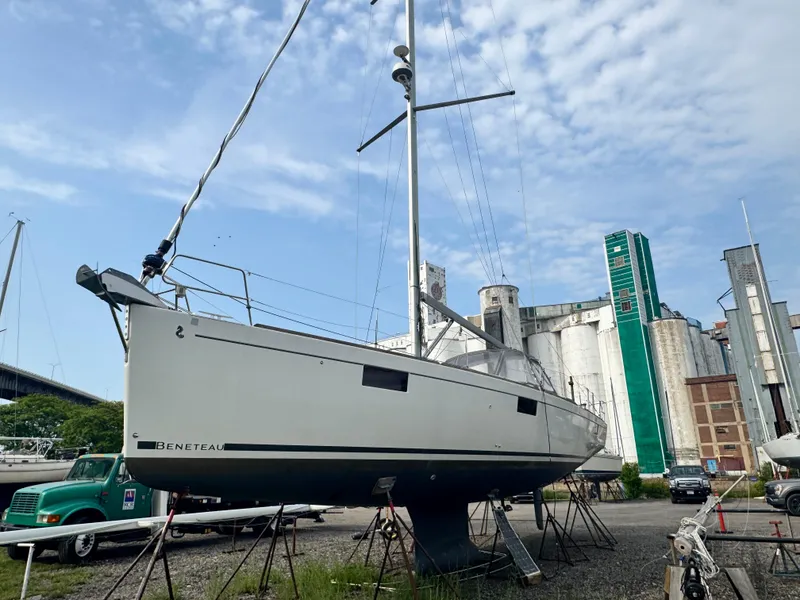 The Image of 2014 Beneteau Oceanis 48 sailboat on stands, industrial background, clear sky. - 0