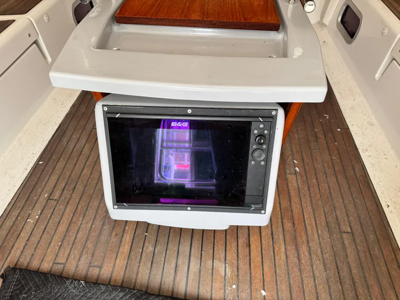 Slide: The Image of B&G navigation system on 2014 Beneteau Oceanis 48 yacht, wooden deck background. - 10