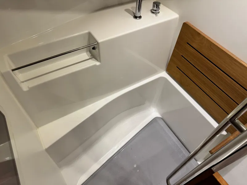 Slide: The Image of Beneteau Oceanis 48 (2014) bathroom with modern fixtures and wooden accents. - 29
