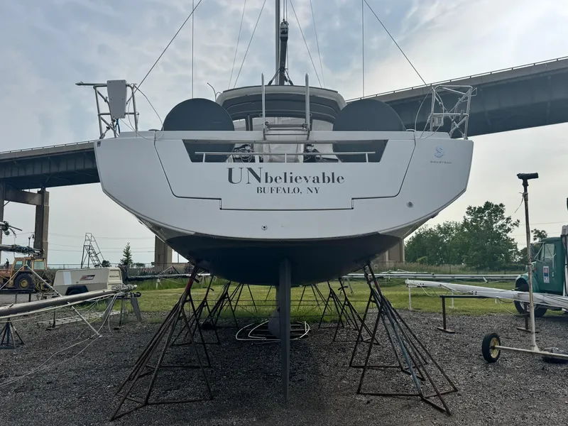 Slide: The Image of 2014 Beneteau Oceanis 48 sailboat on stands, labeled "UNbelievable," in Buffalo, NY. - 3