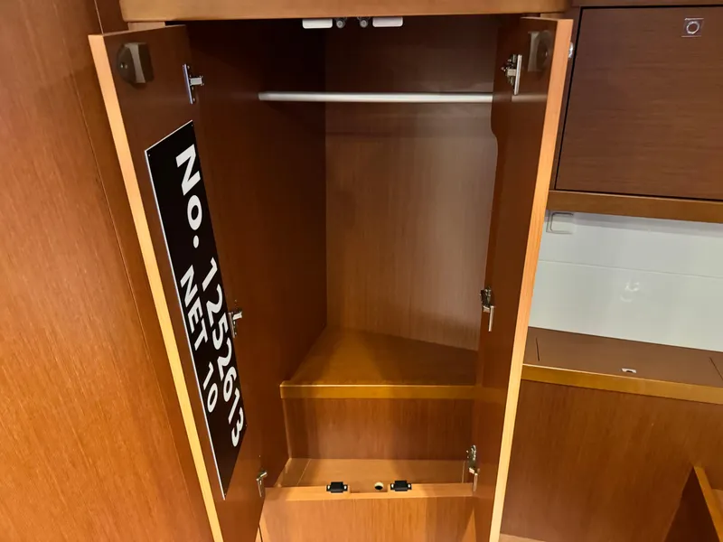 Slide: The Image of Empty wooden closet inside a 2014 Beneteau Oceanis 48 yacht. - 33