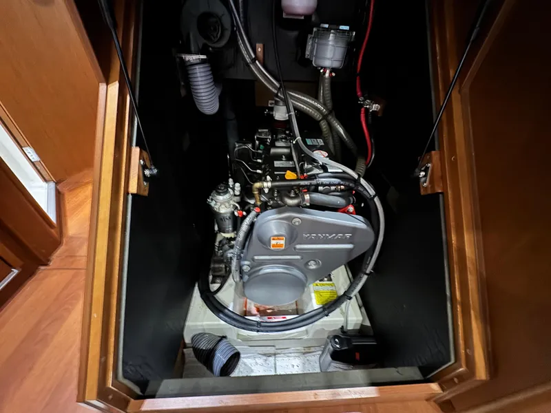 Slide: The Image of Engine compartment of a 2014 Beneteau Oceanis 48 sailboat, showcasing mechanical components. - 37