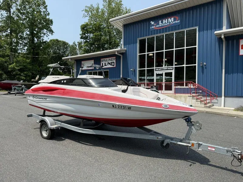 Slide: The Image of 2013 Crownline 185 SS boat on trailer outside dealership. - 2