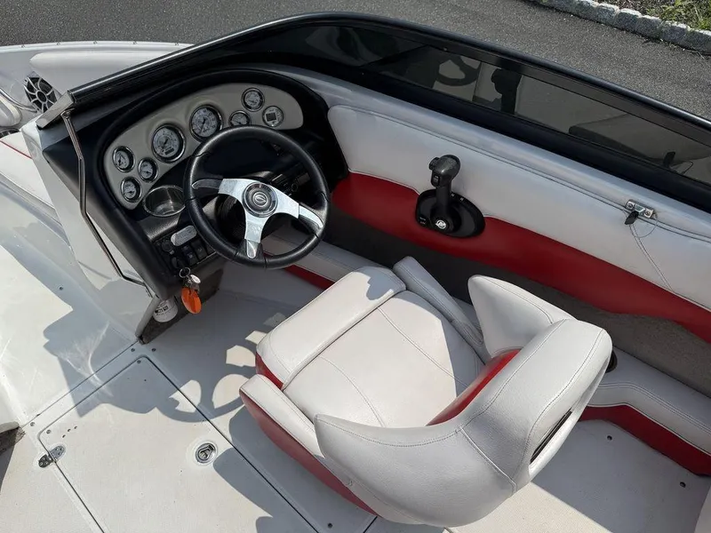 Slide: The Image of 2013 Crownline 185 SS boat interior with steering wheel and gauges. - 5