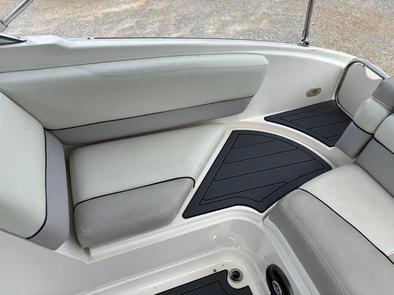 Slide: The Image of Interior seating of a 2009 Bryant 268 boat with cushioned seats and non-slip flooring. - 14
