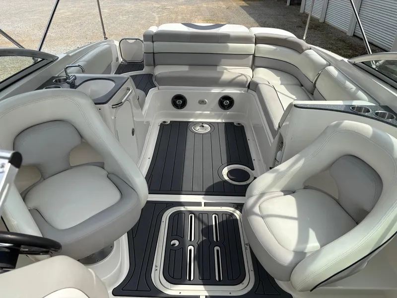 Slide: The Image of 2009 Bryant 268 boat interior with plush seating and sleek design. - 4
