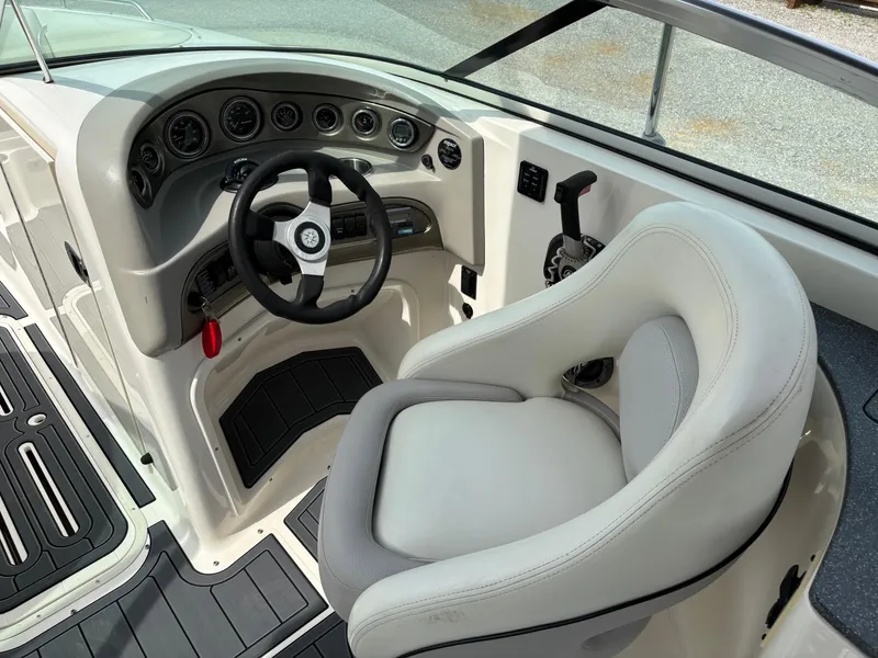 Slide: The Image of 2009 Bryant 268 boat cockpit with steering wheel and control panel. - 5