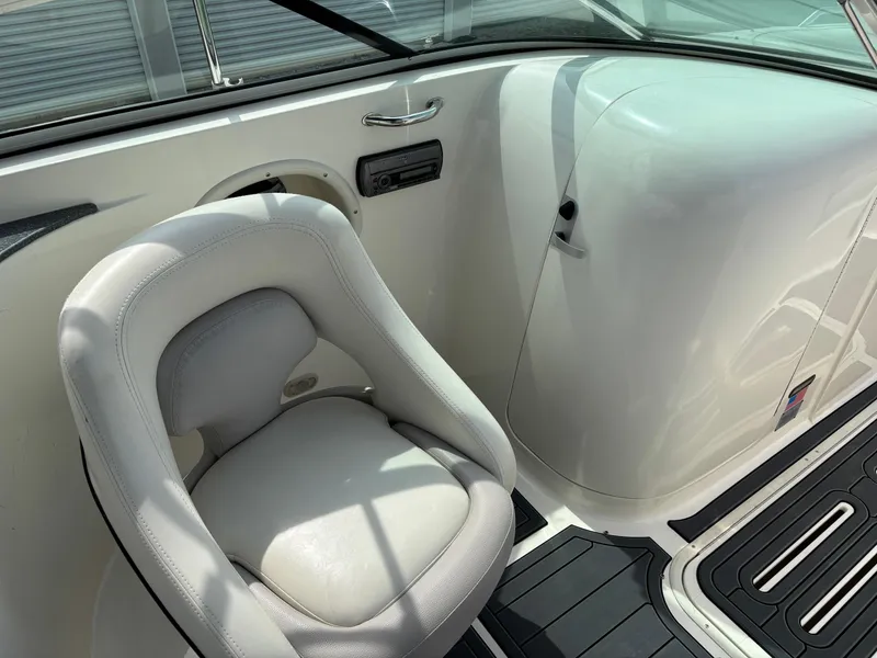 Slide: The Image of 2009 Bryant 268 boat interior with white seating and sleek design. - 6