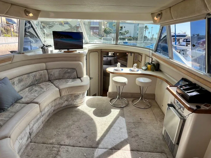 Slide: The Image of Luxurious interior of a 1996 Sea Ray 370 Sedan Bridge yacht with plush seating and modern amenities. - 22