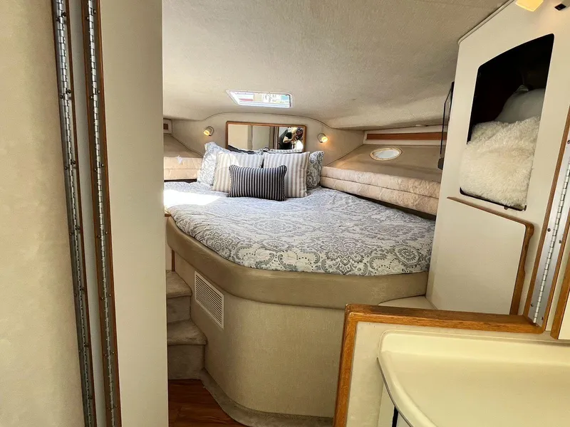 Slide: The Image of 1996 Sea Ray 370 Sedan Bridge cabin with cozy bed and elegant decor. - 25
