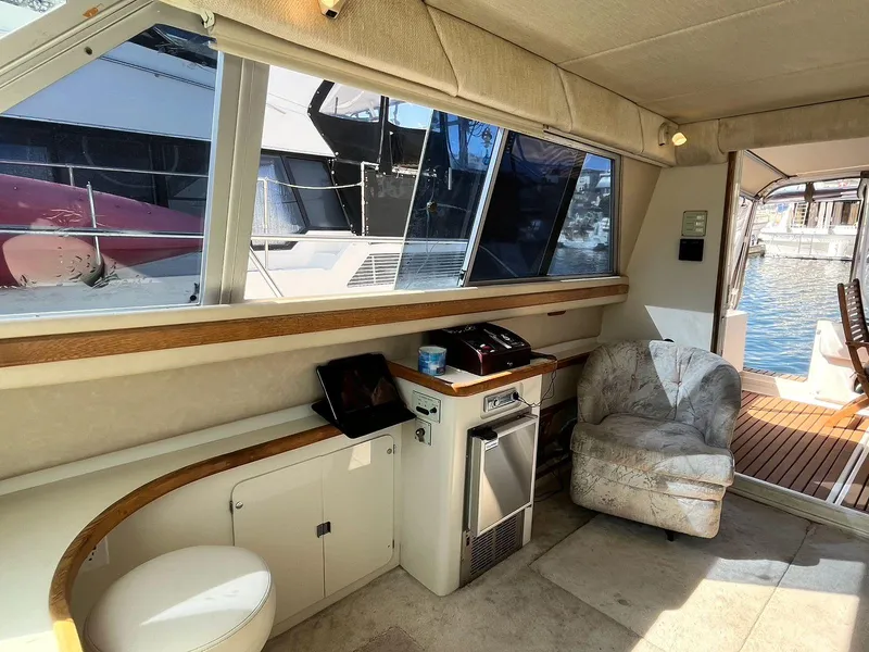 Slide: The Image of Interior of 1996 Sea Ray 370 Sedan Bridge yacht with seating and windows. - 44