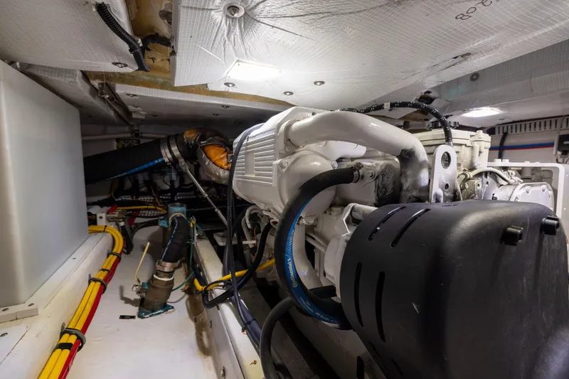 Slide: The Image of Engine room of 2018 Back Cove Downeast 37 boat, showcasing mechanical components and wiring. - 48