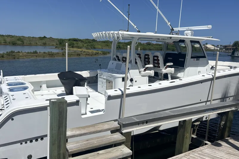 Slide: The Image of 2022 Freeman 47 boat cruising on open water under a clear blue sky. - 1