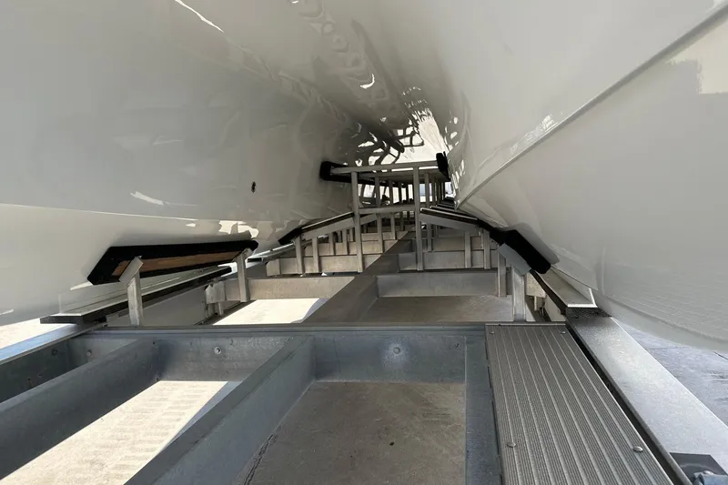 Slide: The Image of Underneath view of a 2022 Freeman 47 boat on a trailer. - 103